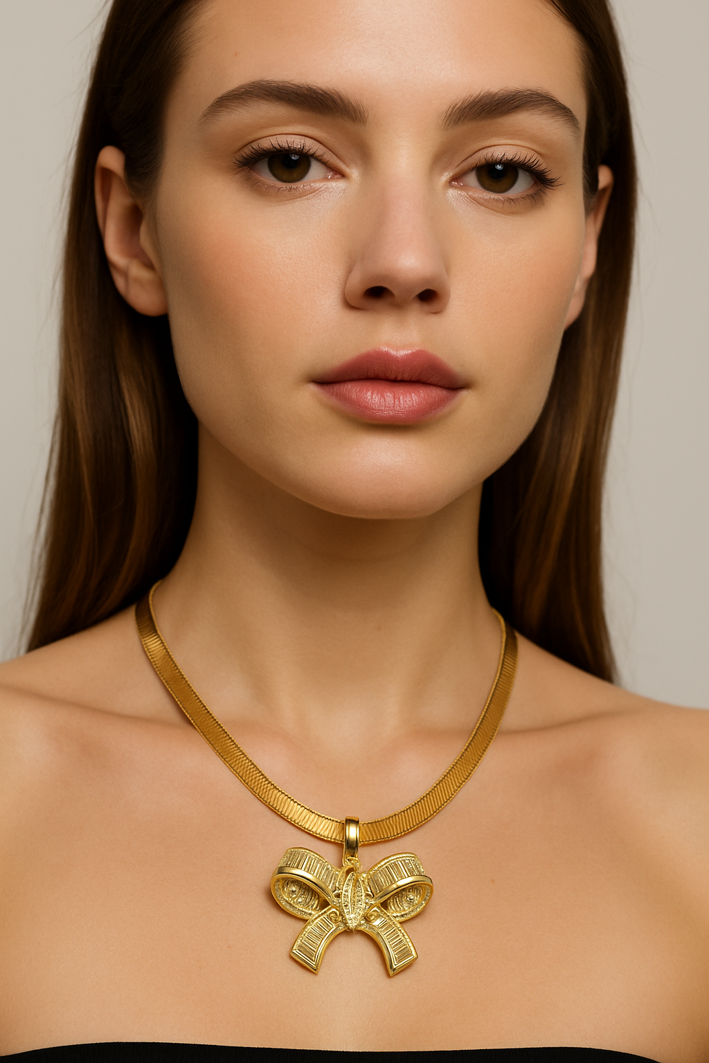 Gold Bow Pendant Necklace with Mixed‑Cut Crystals on Snake Chain